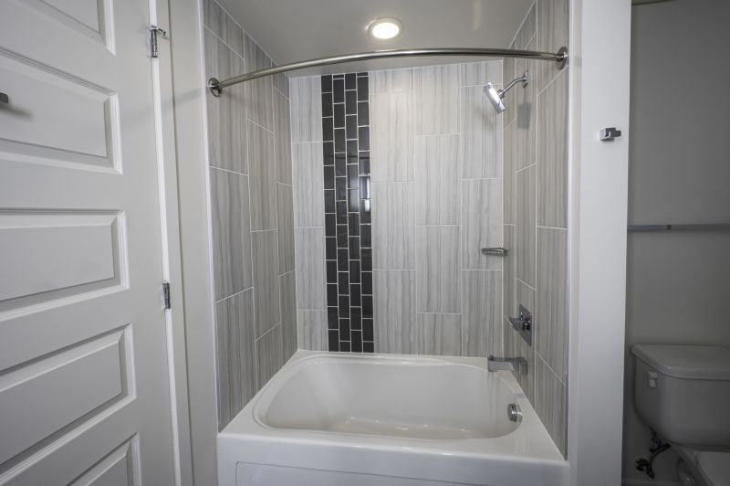New Bathtub with Surrounding Tile Work